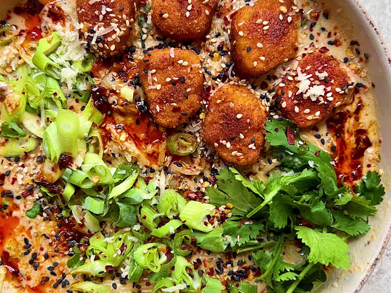 Coated Quorn Nuggets in ramen broth with spring onion and coriander garnish