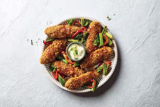 Quorn Salt and Pepper Tenders, served with hot honey-glazed baby red peppers and spring onions and a pot of mayonnaise.