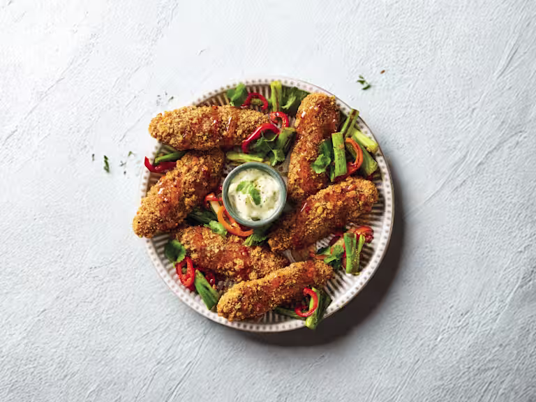 Quorn Salt and Pepper Tenders, served with hot honey-glazed baby red peppers and spring onions and a pot of mayonnaise.