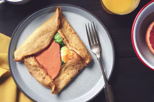 A buckwheat pancake filled with Quorn Vegetarian Bacon Slices, cheese, and eggs.