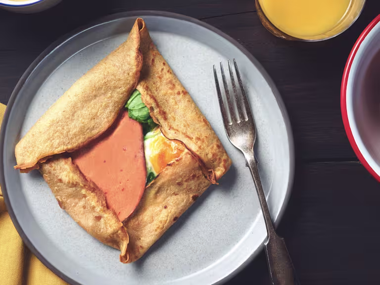 A buckwheat pancake filled with Quorn Vegetarian Bacon Slices, cheese, and eggs.