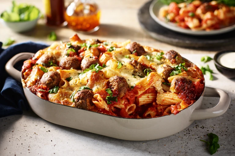 A pasta bake with a tomato sauce and Quorn Swedish Style Balls topped with cheese and coriander.