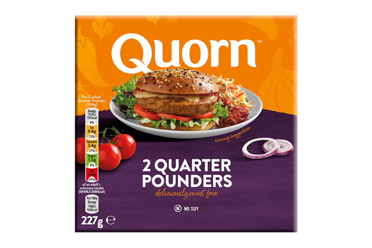 A box of Quorn Quarter Pounders showing a prepared and plated burger and product information on an orange and purple background.