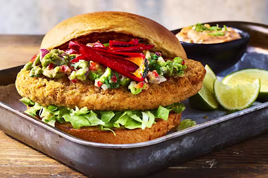 Quorn burger served on a steel baking tray.