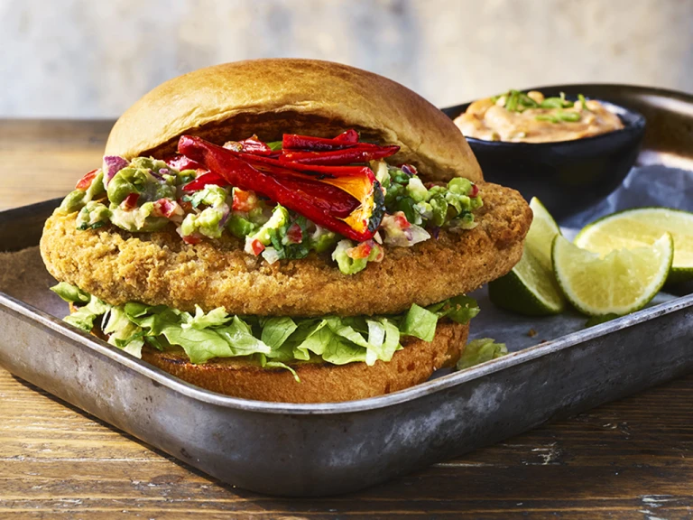 Quorn burger served on a steel baking tray.