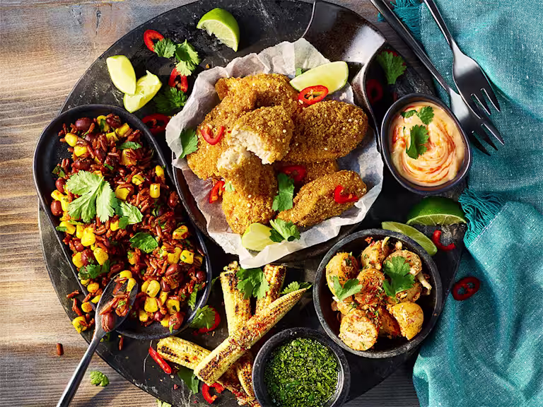 Quorn Cajun Wings Sharing Platter including various dips and sides.