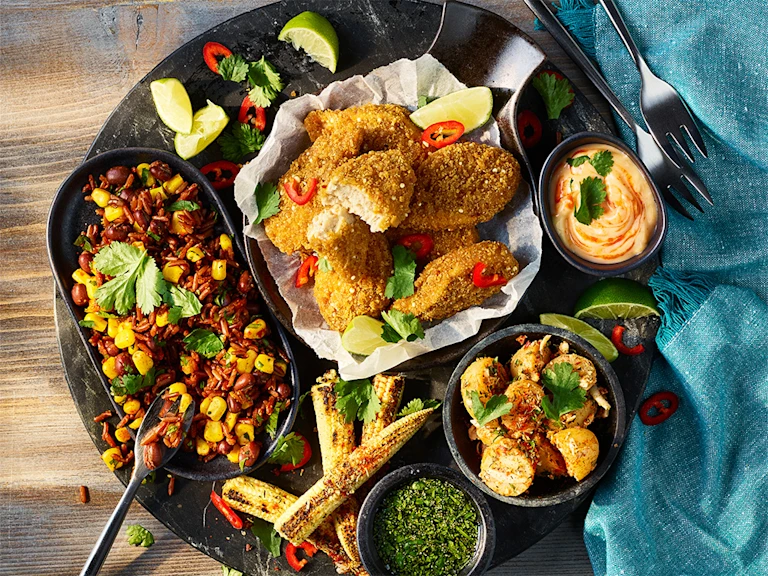Quorn Cajun Wings Sharing Platter including various dips and sides.
