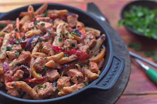 Quick pasta recipe made with vegetarian Quorn Pieces, pasta and peppers served in a black dish