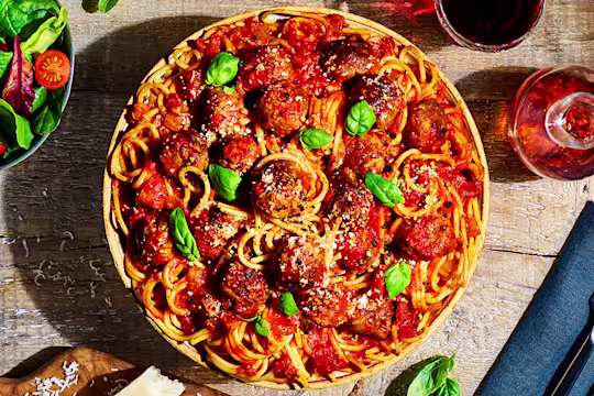 A bowl of vegetarian spaghetti and Quorn Swedish Style Balls in a tomato sauce.