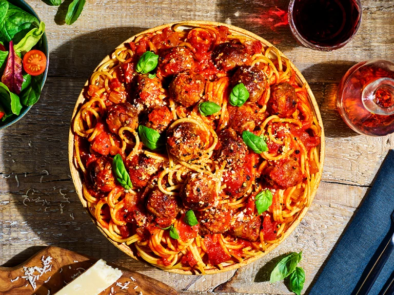 A bowl of vegetarian spaghetti and Quorn Swedish Style Balls in a tomato sauce.