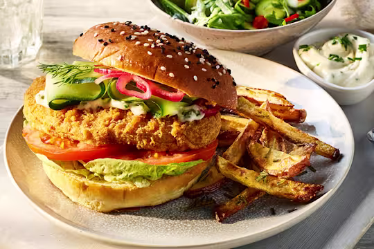 Quorn Spicy Vegan Buffalo Fillet Burger served alongside Rosemary fries.