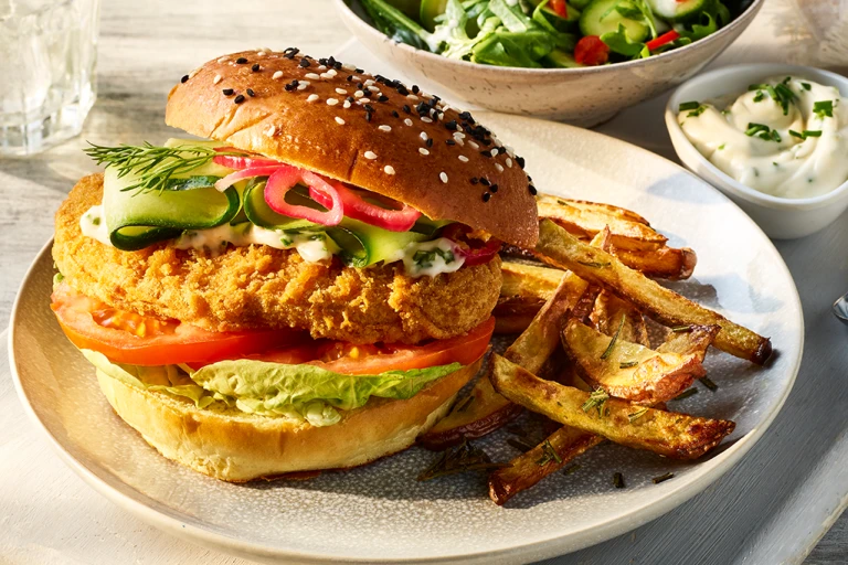 Quorn Spicy Vegan Buffalo Fillet Burger served alongside Rosemary fries.