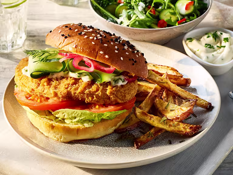 Quorn Spicy Vegan Buffalo Fillet Burger served alongside Rosemary fries.