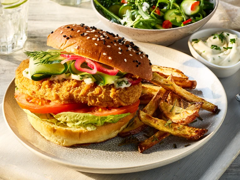 Quorn Spicy Vegan Buffalo Fillet Burger served alongside Rosemary fries.