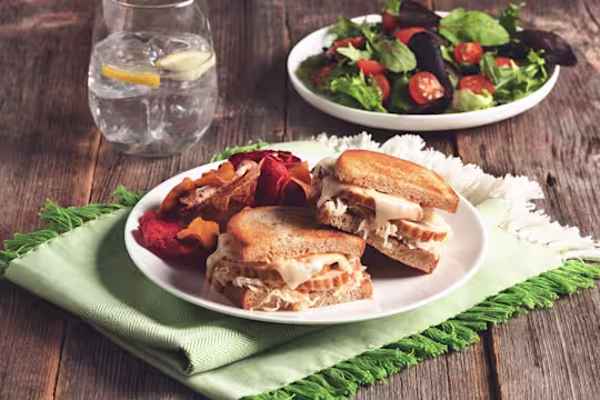 Toasted sandwiches filled with swiss cheese, sauerkraut, and sliced Quorn Roast.