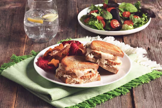 Toasted sandwiches filled with swiss cheese, sauerkraut, and sliced Quorn Roast.
