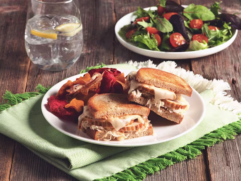Toasted sandwiches filled with swiss cheese, sauerkraut, and sliced Quorn Roast.