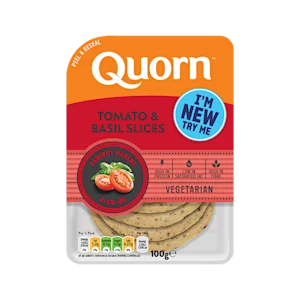 Orange Quorn Tomato & Basil Slices peel and reseal packaging, with a blue new product label and serving suggestion of panini, tomato and basil.
