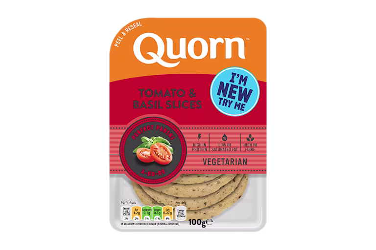 Orange Quorn Tomato & Basil Slices peel and reseal packaging, with a blue new product label and serving suggestion of panini, tomato and basil.