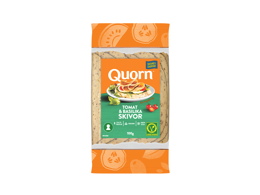 Orange Quorn Tomato & Basil Slices peel and reseal packaging, with a blue new product label and serving suggestion of panini, tomato and basil. 