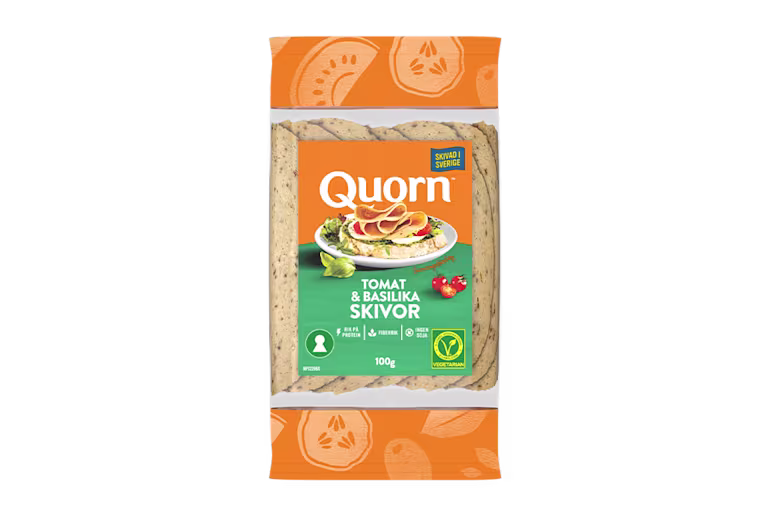 Orange Quorn Tomato & Basil Slices peel and reseal packaging, with a blue new product label and serving suggestion of panini, tomato and basil.