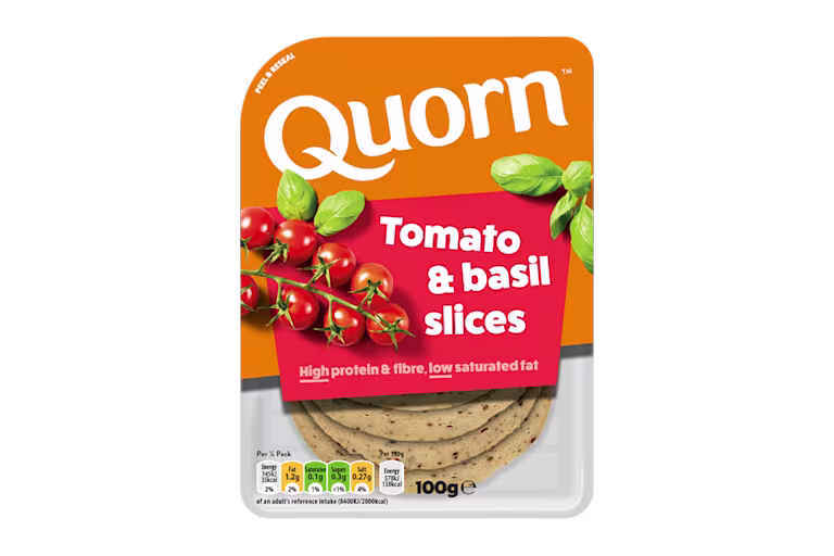 Orange Quorn Tomato & Basil Slices peel and reseal packaging, with a blue new product label and serving suggestion of panini, tomato and basil.