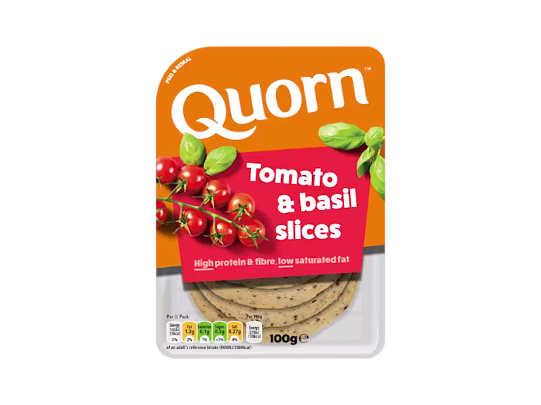 Orange Quorn Tomato & Basil Slices peel and reseal packaging, with a blue new product label and serving suggestion of panini, tomato and basil.