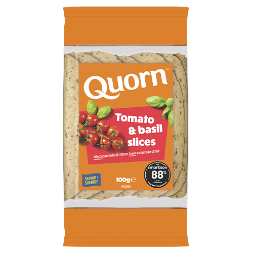 Orange Quorn Tomato & Basil Slices peel and reseal packaging, with a blue new product label and serving suggestion of panini, tomato and basil. 