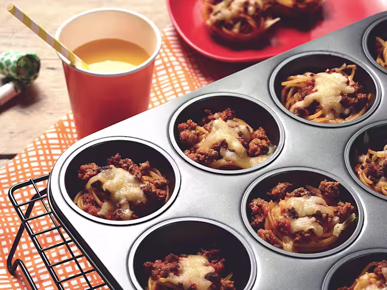 Easy meals for kids made with Quorn Mince on individual beds of spaghetti served in a muffin pan on top of a cooling rack