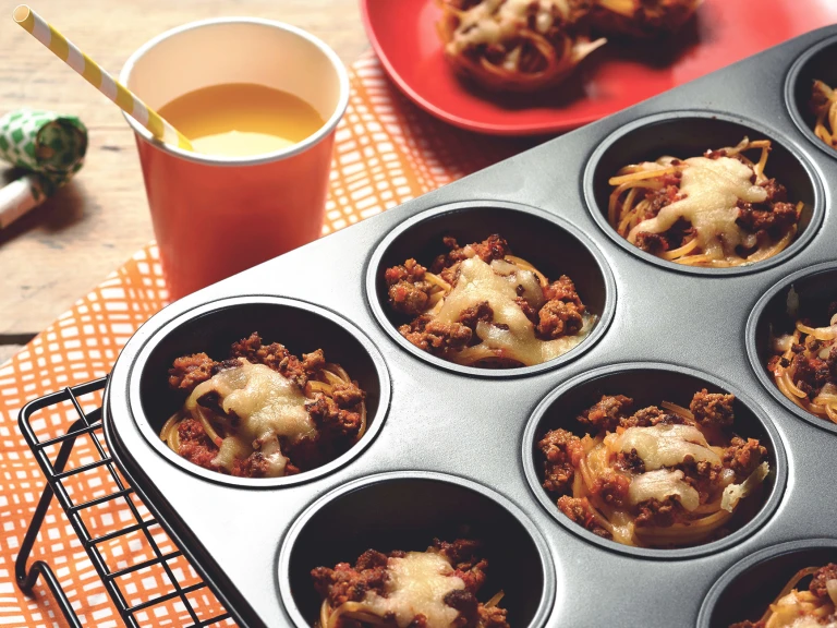 Easy meals for kids made with Quorn Mince on individual beds of spaghetti served in a muffin pan on top of a cooling rack