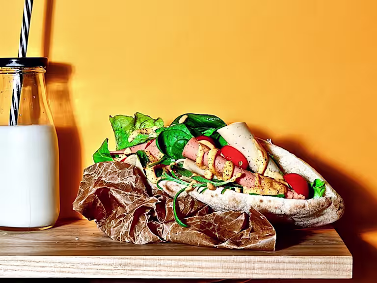 Quorn Vegan Deli Pitta slightly opened to show the filling including Quorn Smoky Ham Free Slices.