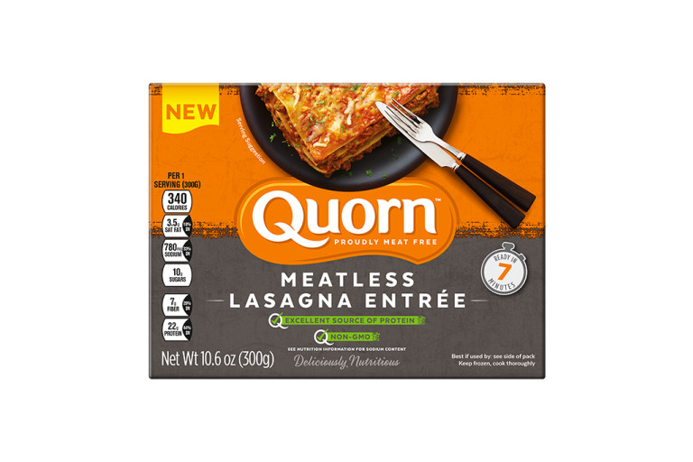 A box of Quorn Meatless Lasagna Entrée showing the plated product and information on an orange and charcoal background.
