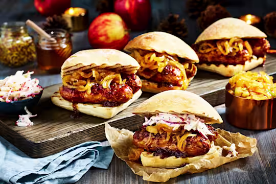 Four ciabatta buns filled with sticky marinated Quorn Sausages and caramelised onions with an apple slaw on the side.