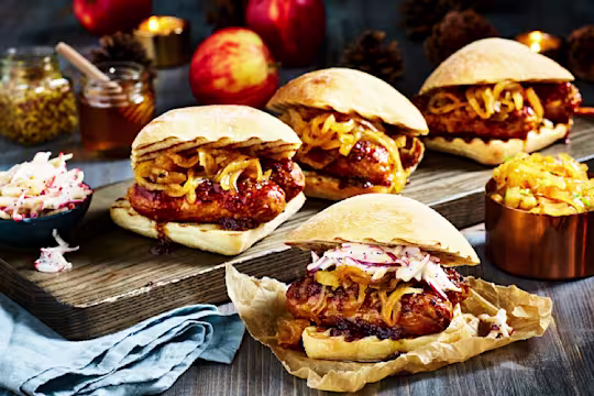 Four ciabatta buns filled with sticky marinated Quorn Sausages and caramelised onions with an apple slaw on the side.