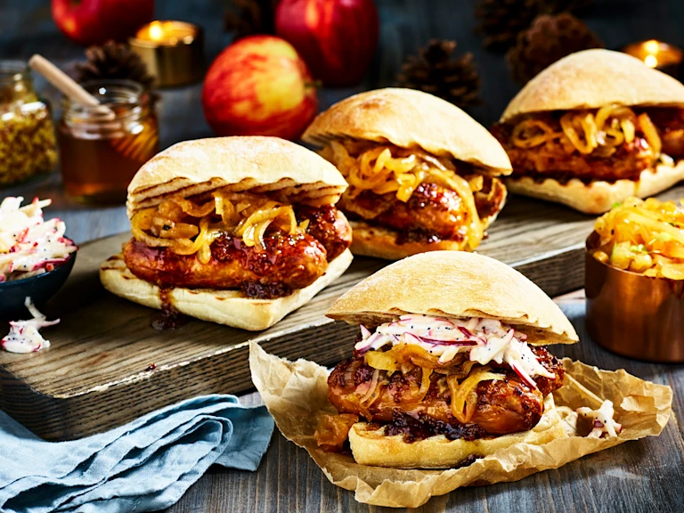 Four ciabatta buns filled with sticky marinated Quorn Sausages and caramelised onions with an apple slaw on the side.