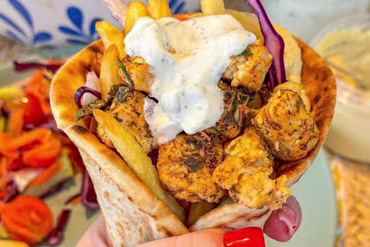 Greek-style flatbread packed with chips, marinated Quorn Vegetarian Chicken Pieces, salad, hummus and tzatziki.