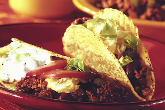 Quorn Vegetarian Mince in taco shells with tomato and lettuce.