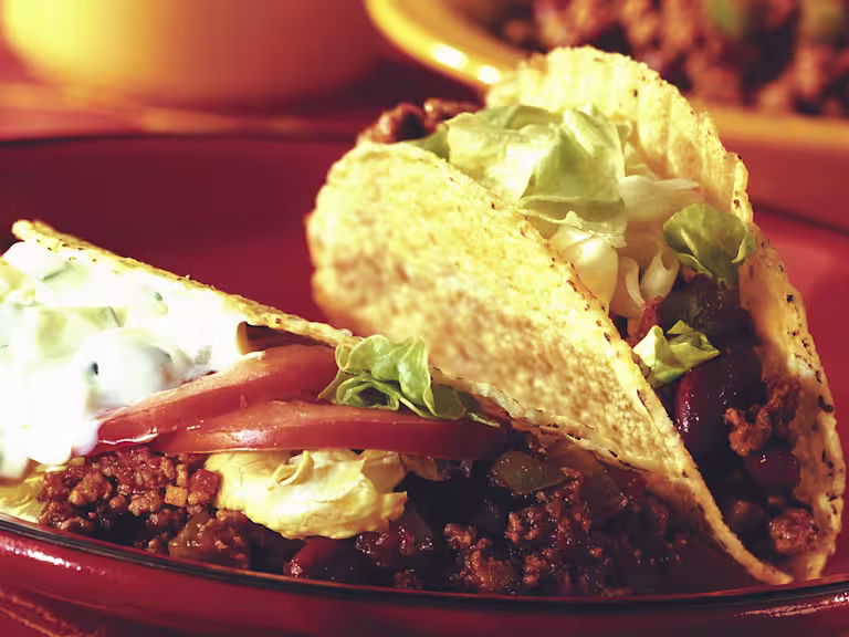 Quorn Vegetarian Mince in taco shells with tomato and lettuce.