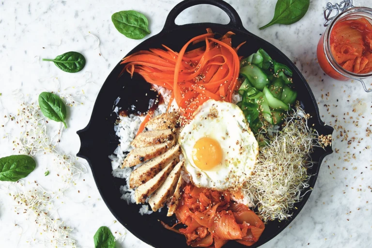 Vegetarian bibimbap made with Quorn Fillets served with rice, vegetables and egg in a skillet