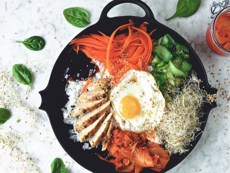 Vegetarian bibimbap made with Quorn Fillets served with rice, vegetables and egg in a skillet