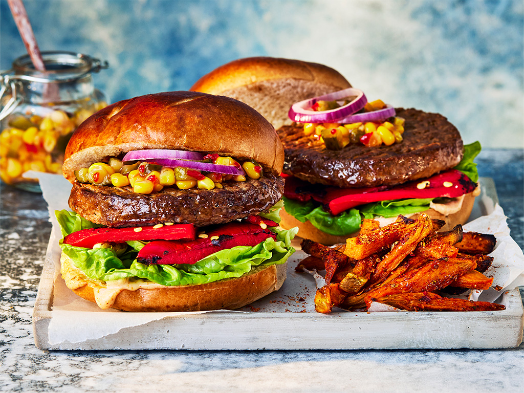 Takeaway Quarter Pounder Burger with seasoned fries and salad overhead shot 