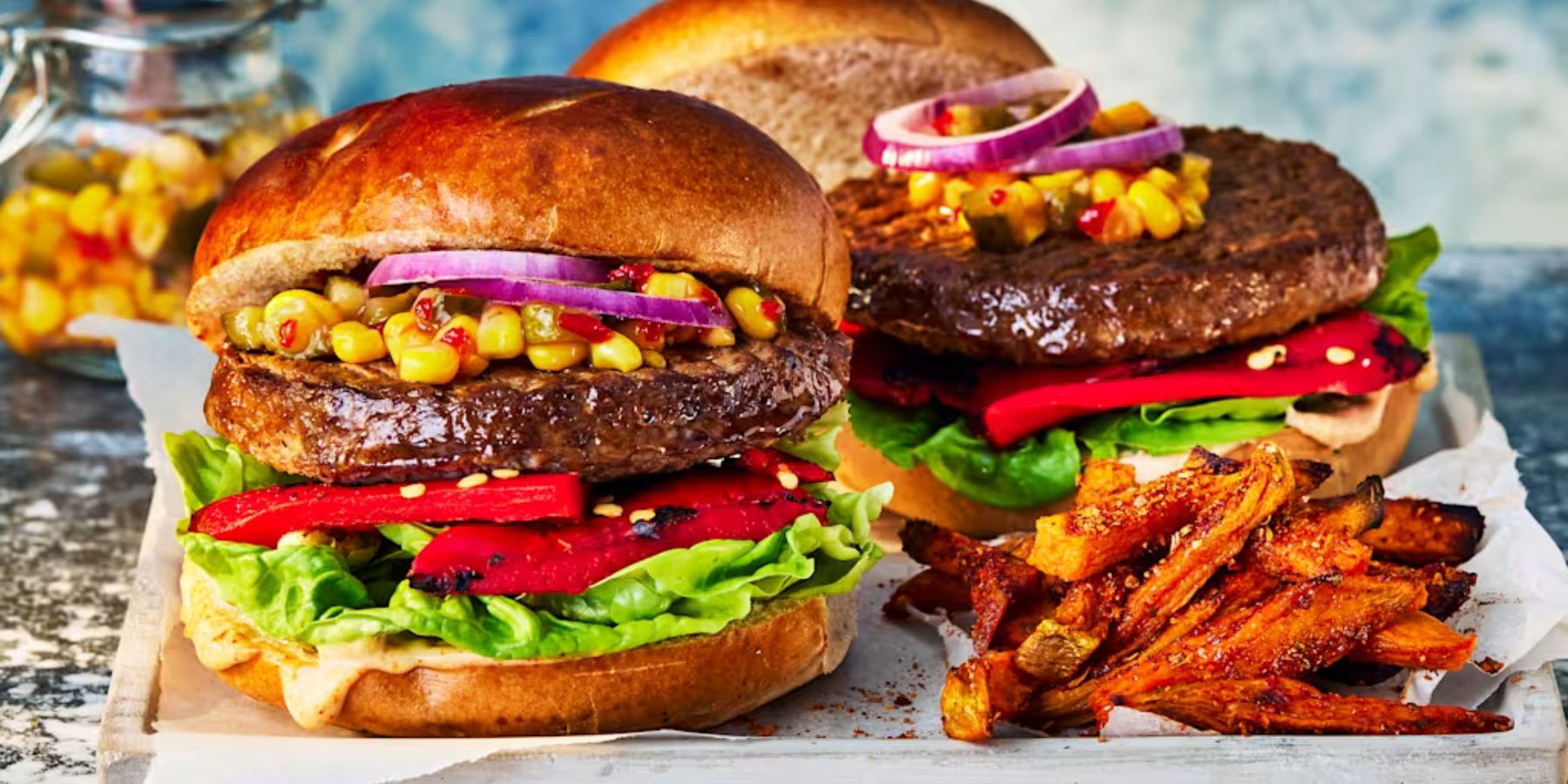 Takeaway Quarter Pounder Burger with seasoned fries and salad overhead shot 