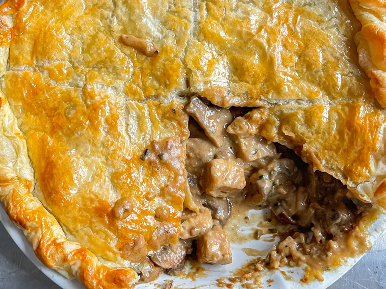 Quorn Pieces miso and mushroom pie with a piece removed in a dish