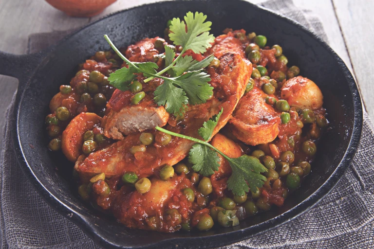 Quorn Vegetarian Durban Curry, made with Quorn Fillets, peas, tomatoes, and potatoes, served in a bowl