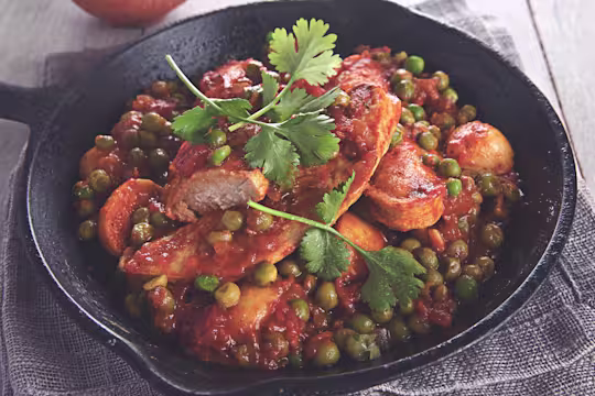 Quorn Vegetarian Durban Curry, made with Quorn Fillets, peas, tomatoes, and potatoes, served in a bowl