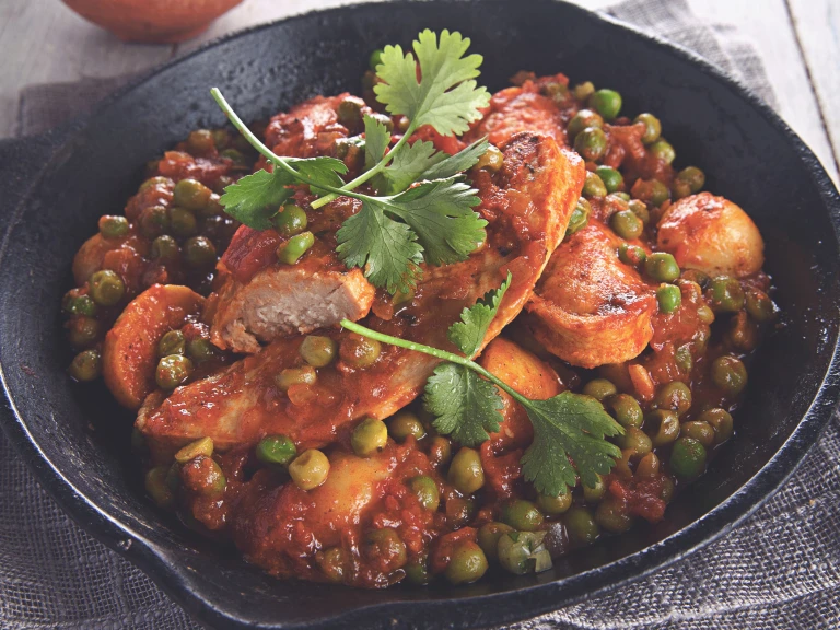 Quorn Vegetarian Durban Curry, made with Quorn Fillets, peas, tomatoes, and potatoes, served in a bowl