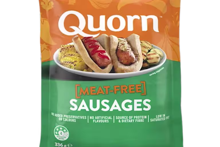 A bag of Quorn Sausages showing the prepared product and information on an orange and charcoal background.