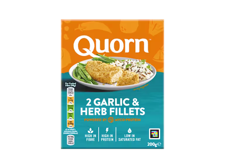 A box of Quorn Garlic & Herb Fillets showing the prepared product and information on an orange and charcoal background.