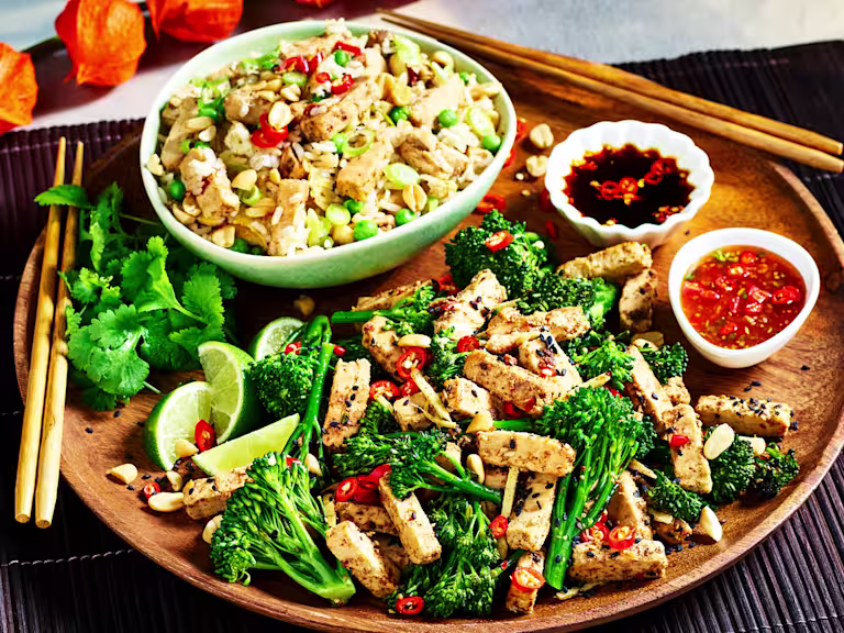 A Chinese-inspired sharing platter with fried rice with strips of Quorn Fillets and a broccoli and ginger stir fry with Quorn Chinese Inspired Salt & Pepper Strips and two sauces.