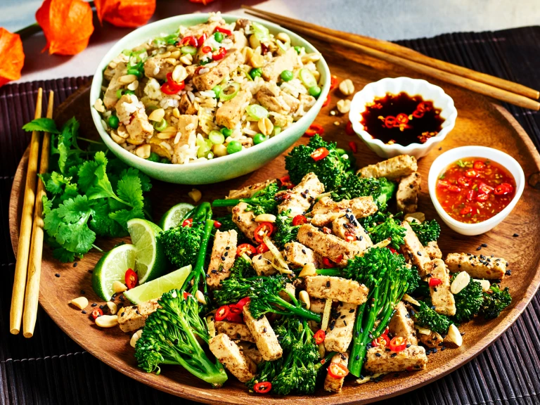 A Chinese-inspired sharing platter with fried rice with strips of Quorn Fillets and a broccoli and ginger stir fry with Quorn Chinese Inspired Salt & Pepper Strips and two sauces.